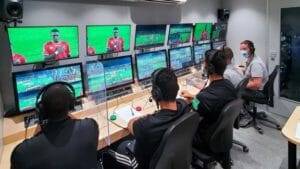 VAR monitor on their PC computer and laptops the sports game of football
